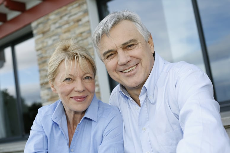 Cheerful senior couple looking at camera