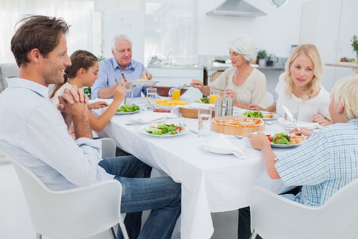 Extended family at the dinner table in kitchen