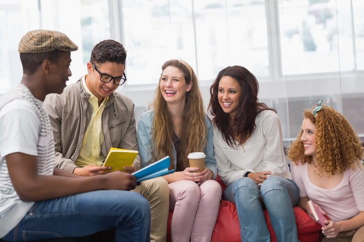 Fashion students chatting and smiling at the college