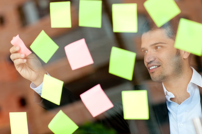 Multitask business man with lots of post-its