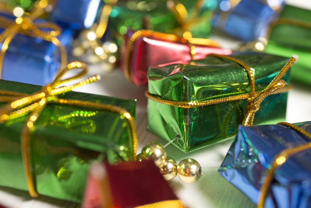 Christmas gifts decoration on a light wooden surface